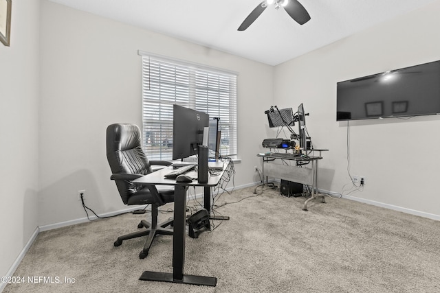 carpeted office with ceiling fan