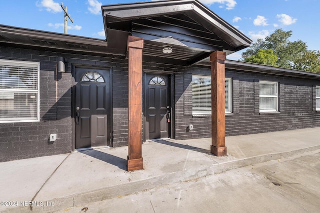 entrance to property with a patio area