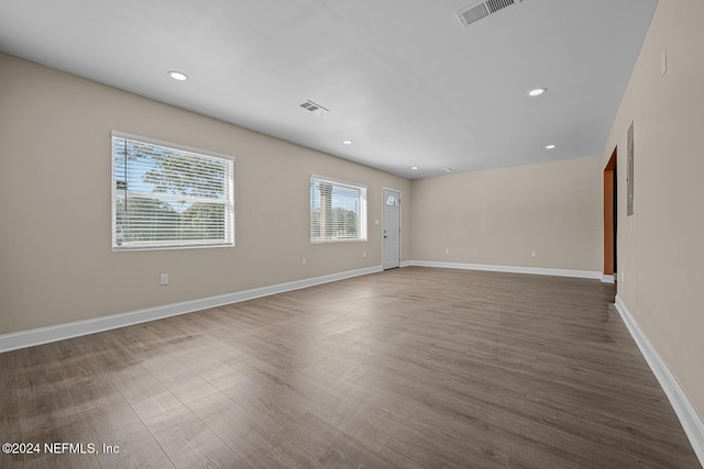 unfurnished room featuring dark wood-type flooring