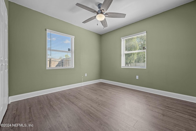 unfurnished room with hardwood / wood-style flooring, plenty of natural light, and ceiling fan