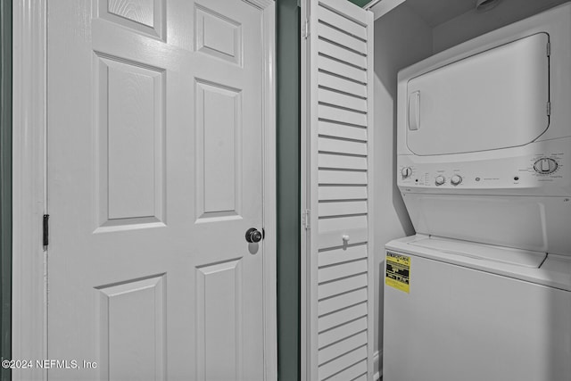 laundry room featuring stacked washer and dryer