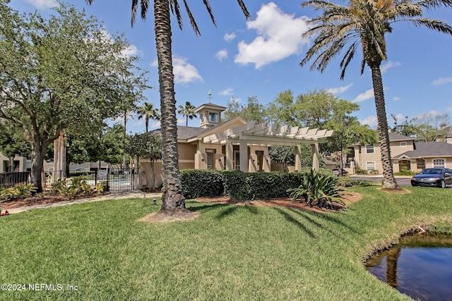 exterior space with a pergola and a front yard