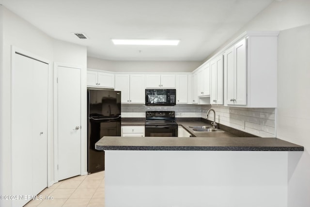 kitchen featuring white cabinets, kitchen peninsula, sink, and black appliances