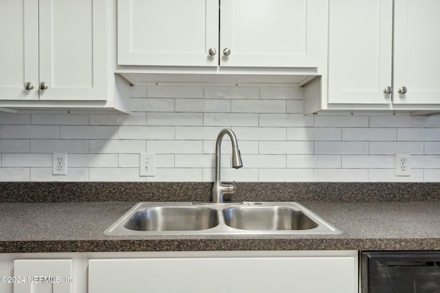 kitchen with sink, decorative backsplash, and white cabinets