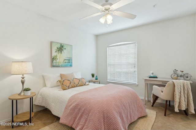 tiled bedroom featuring ceiling fan