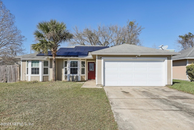 ranch-style home with a front lawn, a garage, and solar panels