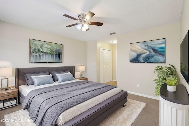 bedroom featuring carpet flooring, ceiling fan, and a closet