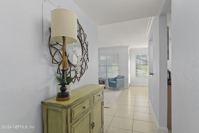 hallway featuring light tile patterned flooring