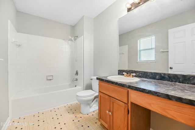 full bathroom featuring vanity, tile patterned floors, tiled shower / bath combo, toilet, and a textured ceiling