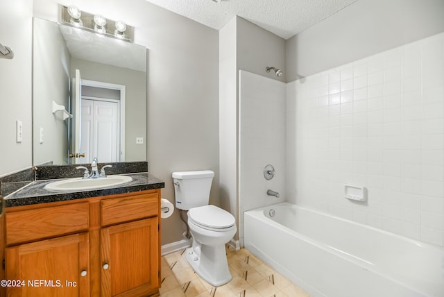 full bathroom featuring shower / bathing tub combination, vanity, toilet, and a textured ceiling