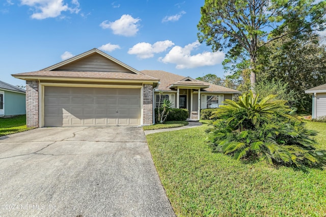 ranch-style house with a garage and a front lawn