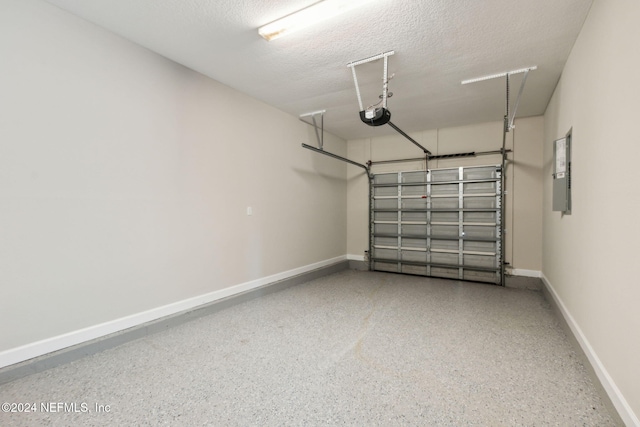 garage with a garage door opener and electric panel