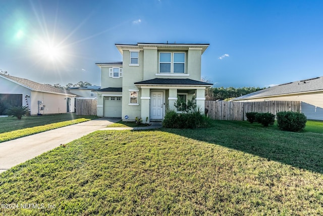 view of front facade featuring a front lawn and a garage