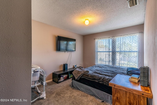 carpeted bedroom with a textured ceiling