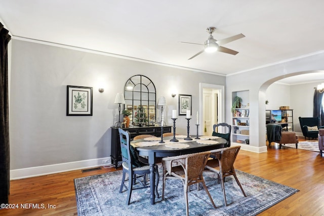 dining area featuring hardwood / wood-style floors, ceiling fan, and crown molding