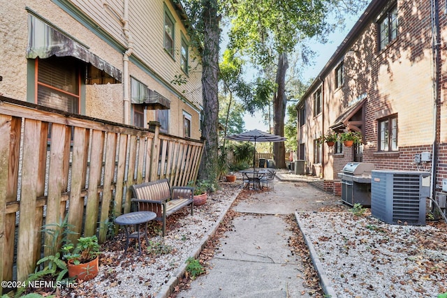 view of patio featuring cooling unit and grilling area