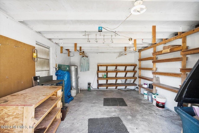 interior space with a workshop area and concrete floors