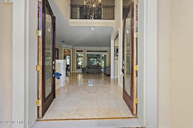 foyer featuring a chandelier