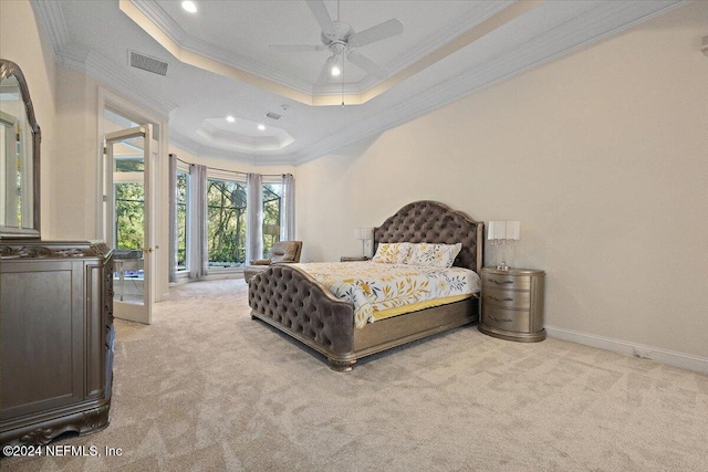 bedroom featuring light carpet, a raised ceiling, crown molding, ceiling fan, and access to exterior