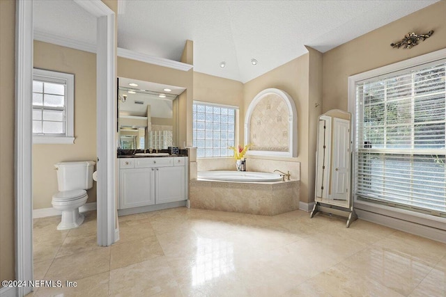 bathroom featuring a textured ceiling, toilet, and a wealth of natural light