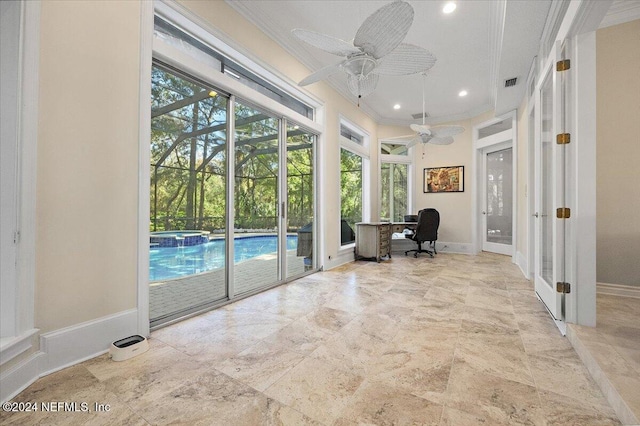 doorway featuring plenty of natural light, ceiling fan, and crown molding