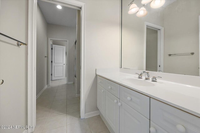 bathroom with tile patterned floors and vanity