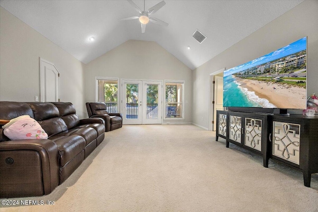 living room featuring light carpet, french doors, high vaulted ceiling, and ceiling fan