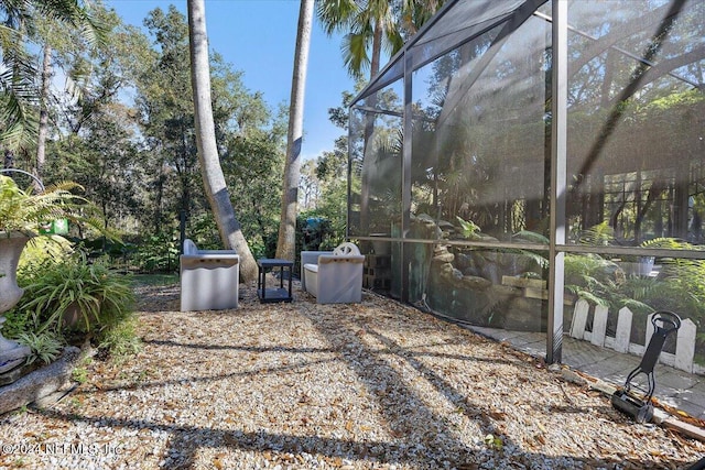 view of yard featuring a lanai and a patio area