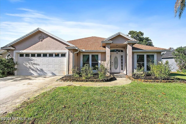 ranch-style home featuring a front yard and a garage