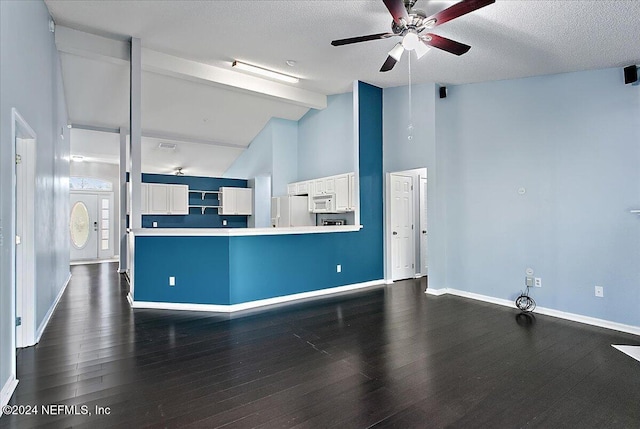 kitchen with white appliances, ceiling fan, beamed ceiling, dark hardwood / wood-style floors, and white cabinetry