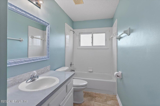 full bathroom featuring tile patterned floors, a textured ceiling, toilet, shower / washtub combination, and vanity