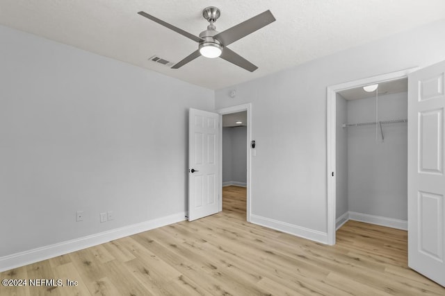 unfurnished bedroom with a closet, ceiling fan, and light hardwood / wood-style flooring