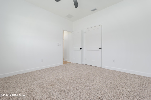 unfurnished bedroom with carpet flooring and ceiling fan