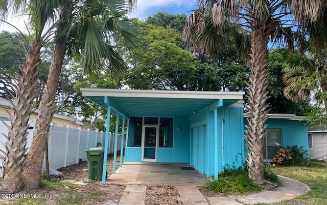 exterior space with a carport