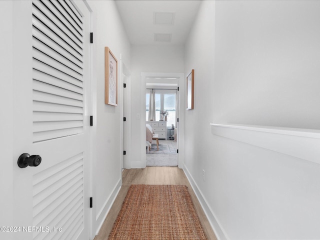 corridor featuring light hardwood / wood-style floors