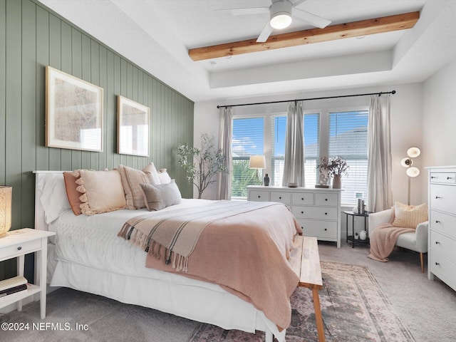 bedroom with beam ceiling, carpet floors, and ceiling fan