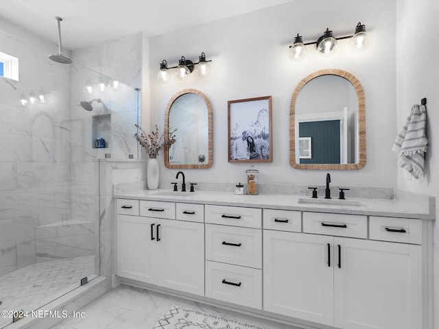 bathroom with vanity and tiled shower