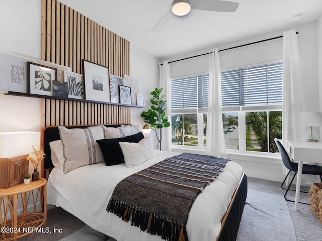 carpeted bedroom featuring ceiling fan