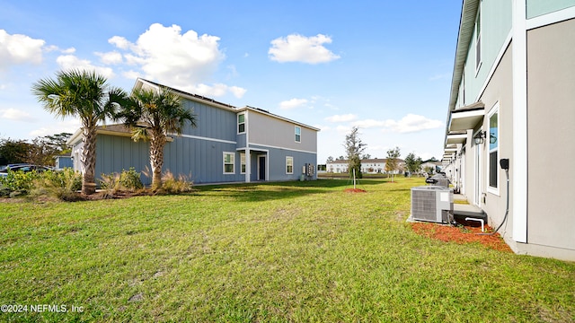 view of yard with central AC