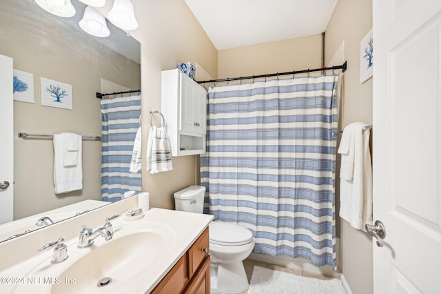 bathroom with a shower with curtain, vanity, and toilet