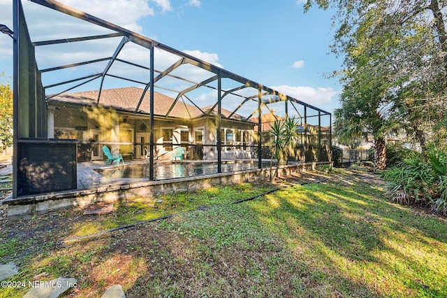 view of yard with a patio area and a lanai