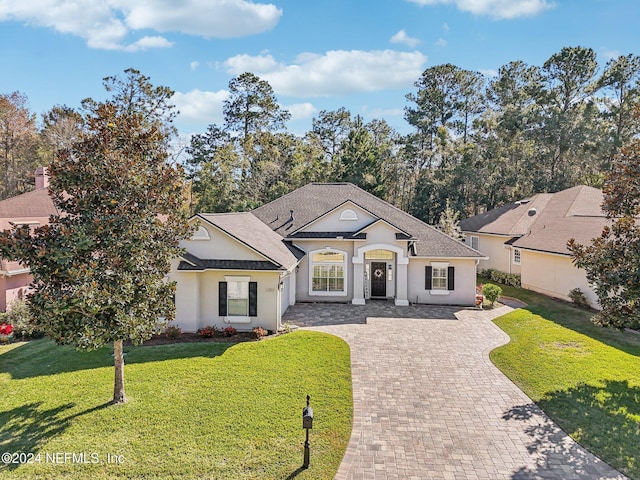 view of front of property with a front lawn