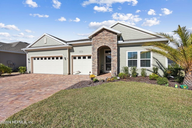 view of front facade with a front yard and a garage