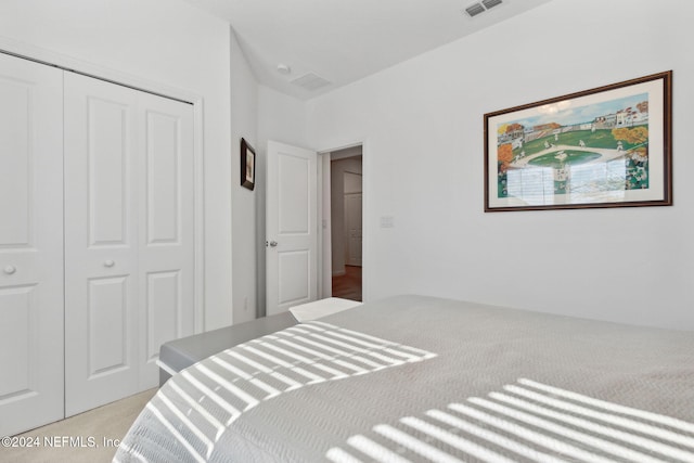 carpeted bedroom with a closet