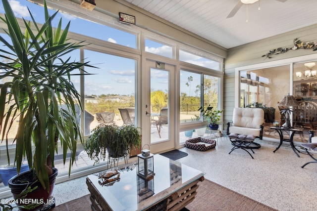 sunroom featuring ceiling fan