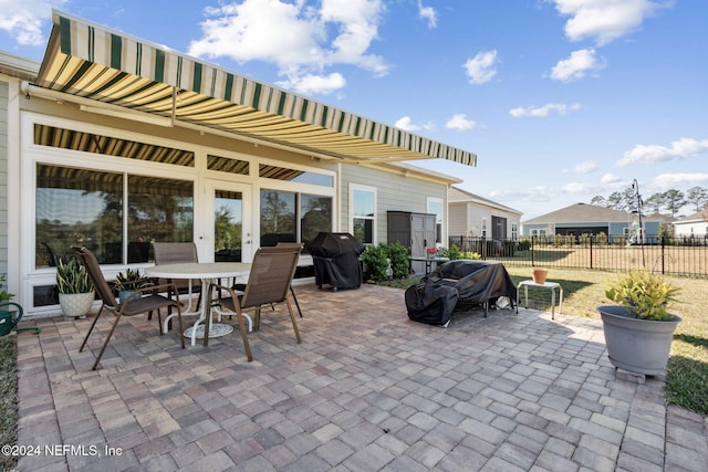 view of patio featuring a grill