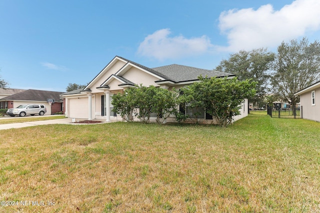 view of front of house featuring a garage and a front yard