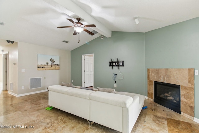 living room featuring a fireplace, vaulted ceiling with beams, and ceiling fan