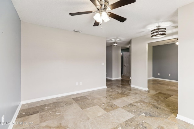 empty room with a textured ceiling