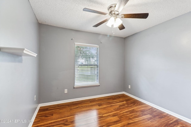 spare room featuring a textured ceiling, hardwood / wood-style flooring, and ceiling fan